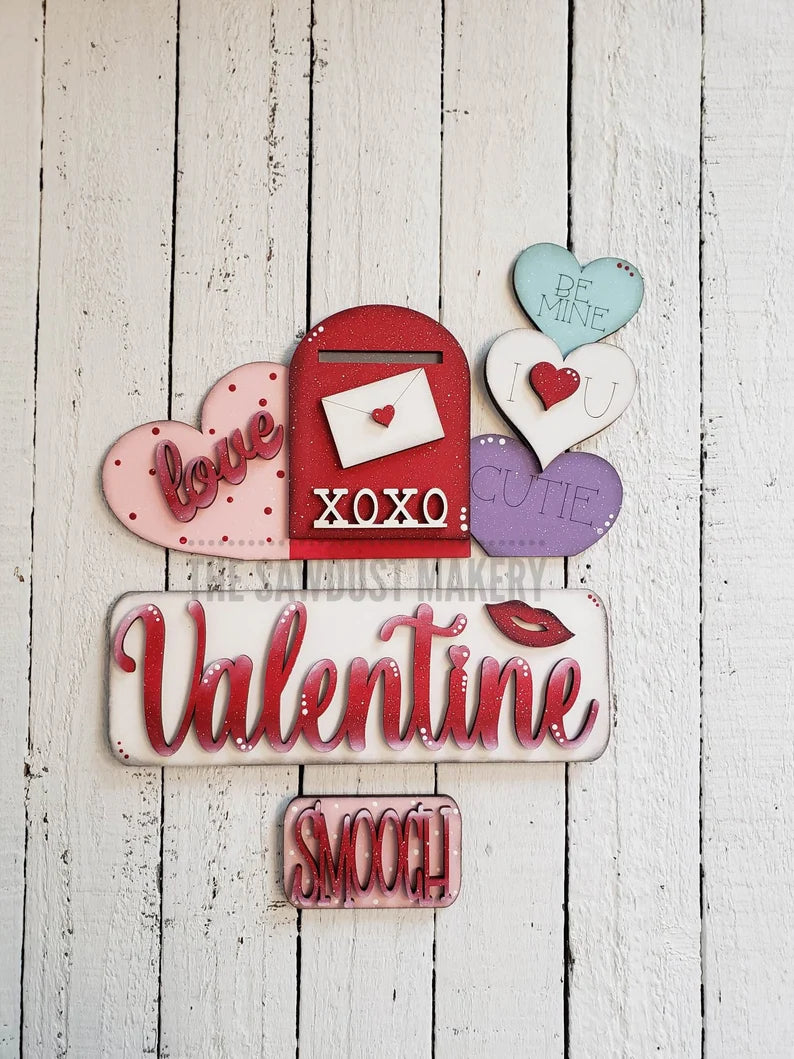 Valentine door hangers and interchangeable trucks at Wandering Roots 1/17/26