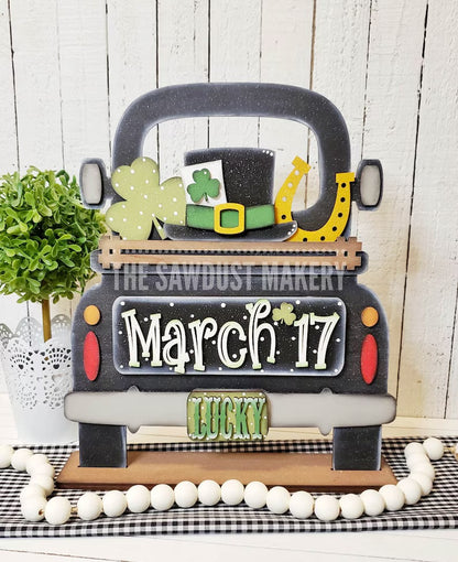 St Patrick's Day door hangers and interchangeable trucks at Wandering Roots 2/27/26