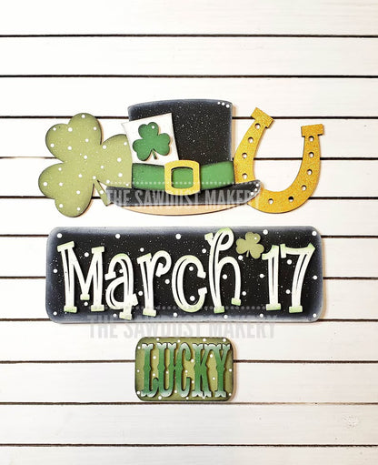 St Patrick's Day door hangers and interchangeable trucks at Wandering Roots 2/27/26