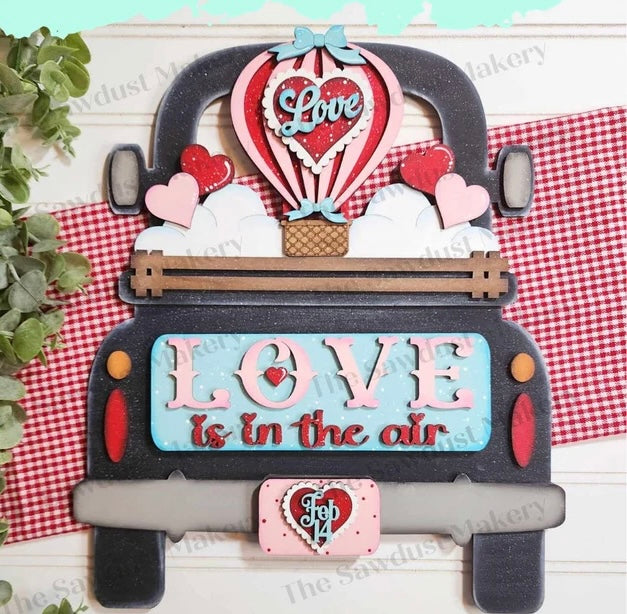 Valentine door hangers and interchangeable trucks at Wandering Roots 1/17/26